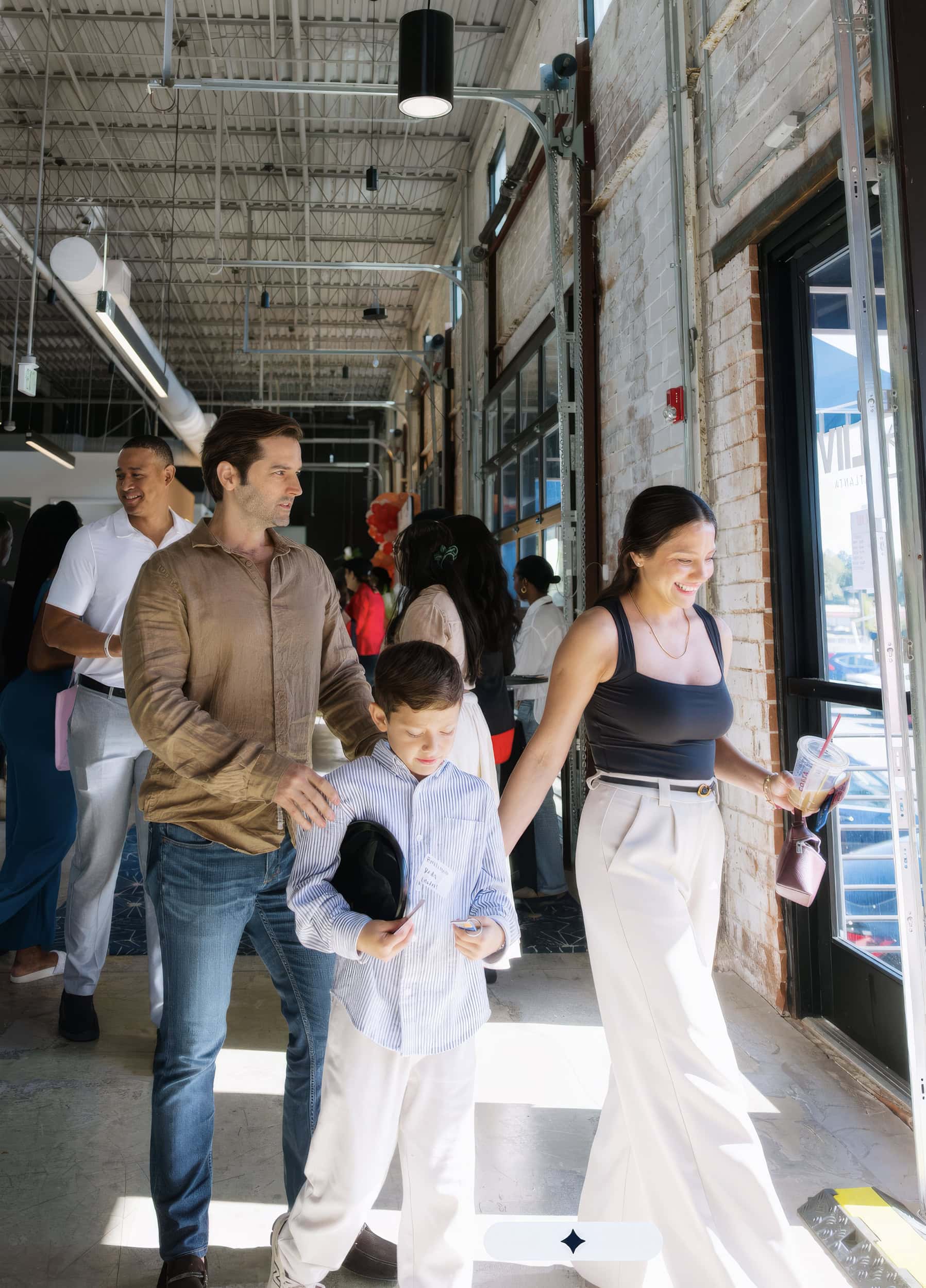 A family arriving in the LIIV foyer